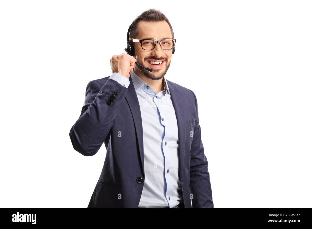 Männlicher Telefonhörer mit einem auf weißem Hintergrund isolierten Headset, das die Kamera anlächelt Stockfoto