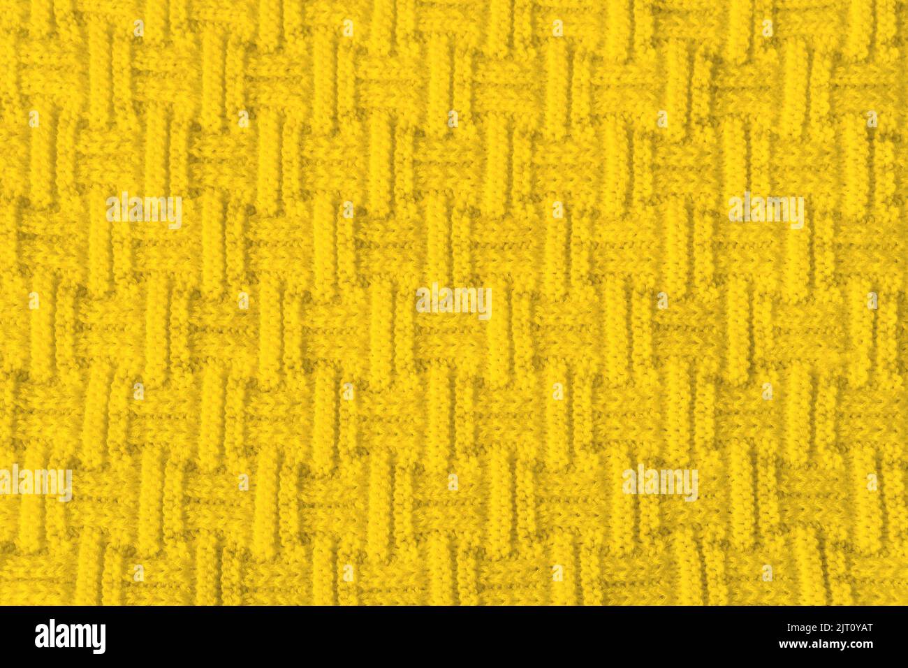 Nahaufnahme der gelben Wollstruktur als abstrakter Stoffhintergrund. Banner für Design Stockfoto