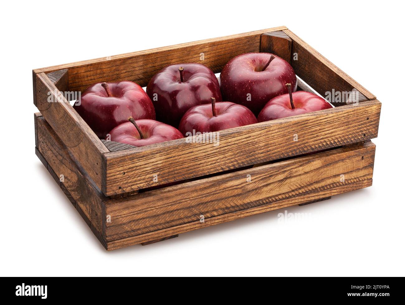 Roter köstlicher Apfel in einem Kastenweg isoliert auf Weiß Stockfoto