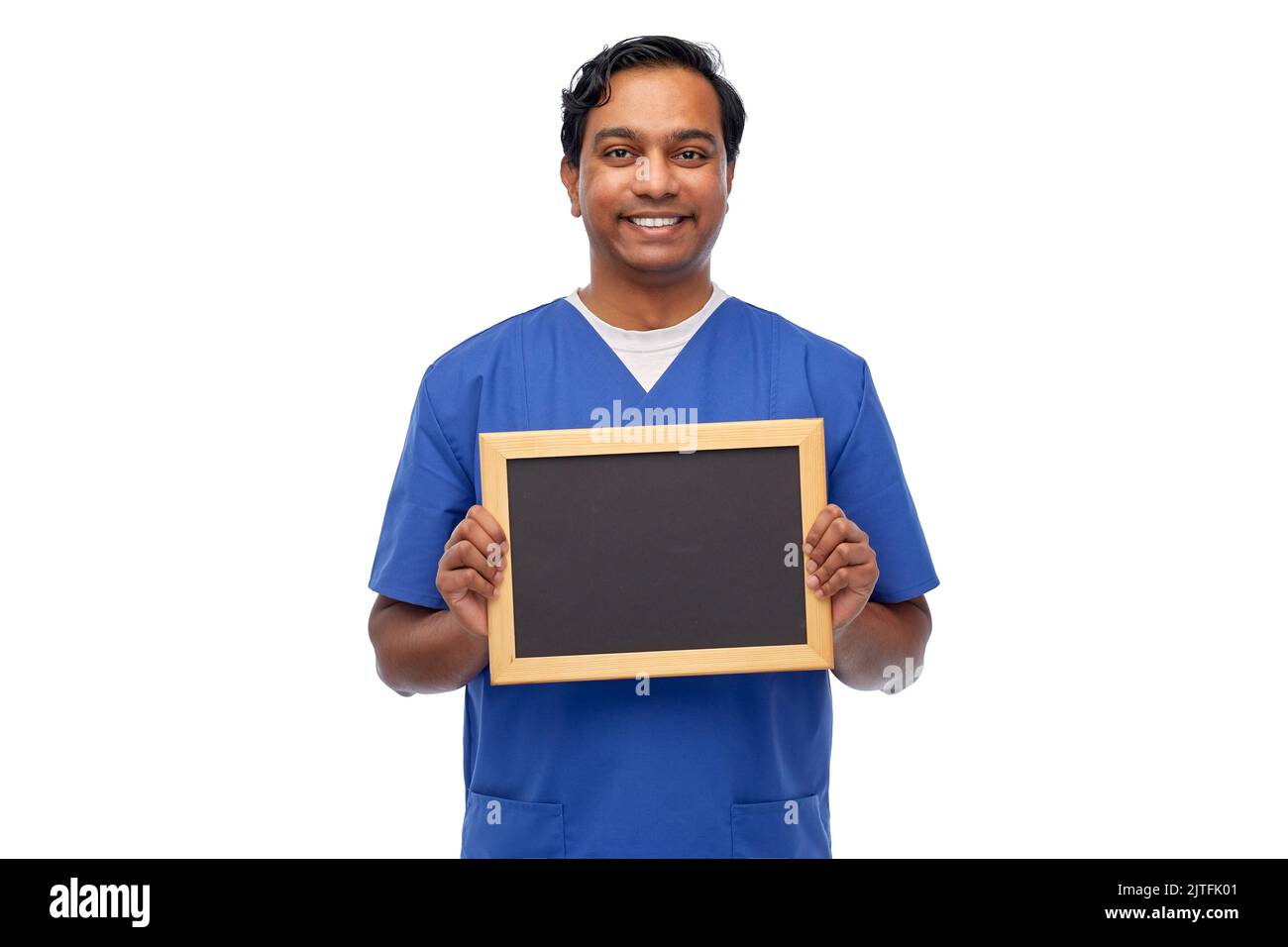 Glücklicher indischer Arzt oder Krankenschwester mit Kreidetafel Stockfoto