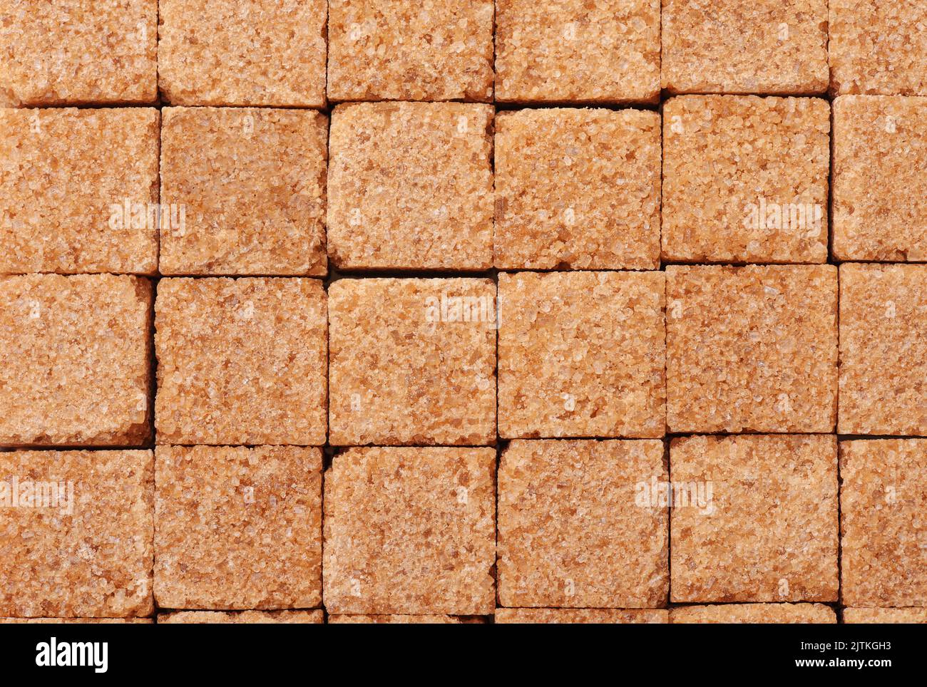 Draufsicht auf braunen Zuckerwürfel Textur Hintergrund Stockfoto