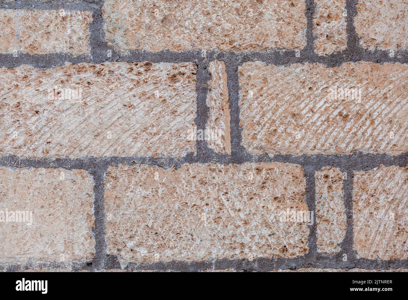 Textur einer Steinmauer. Alte Burg Stein Wand Textur Hintergrund. Stein Wand als Hintergrund oder Textur. Teil einer Mauer aus Stein, für den Hintergrund oder Text Stockfoto
