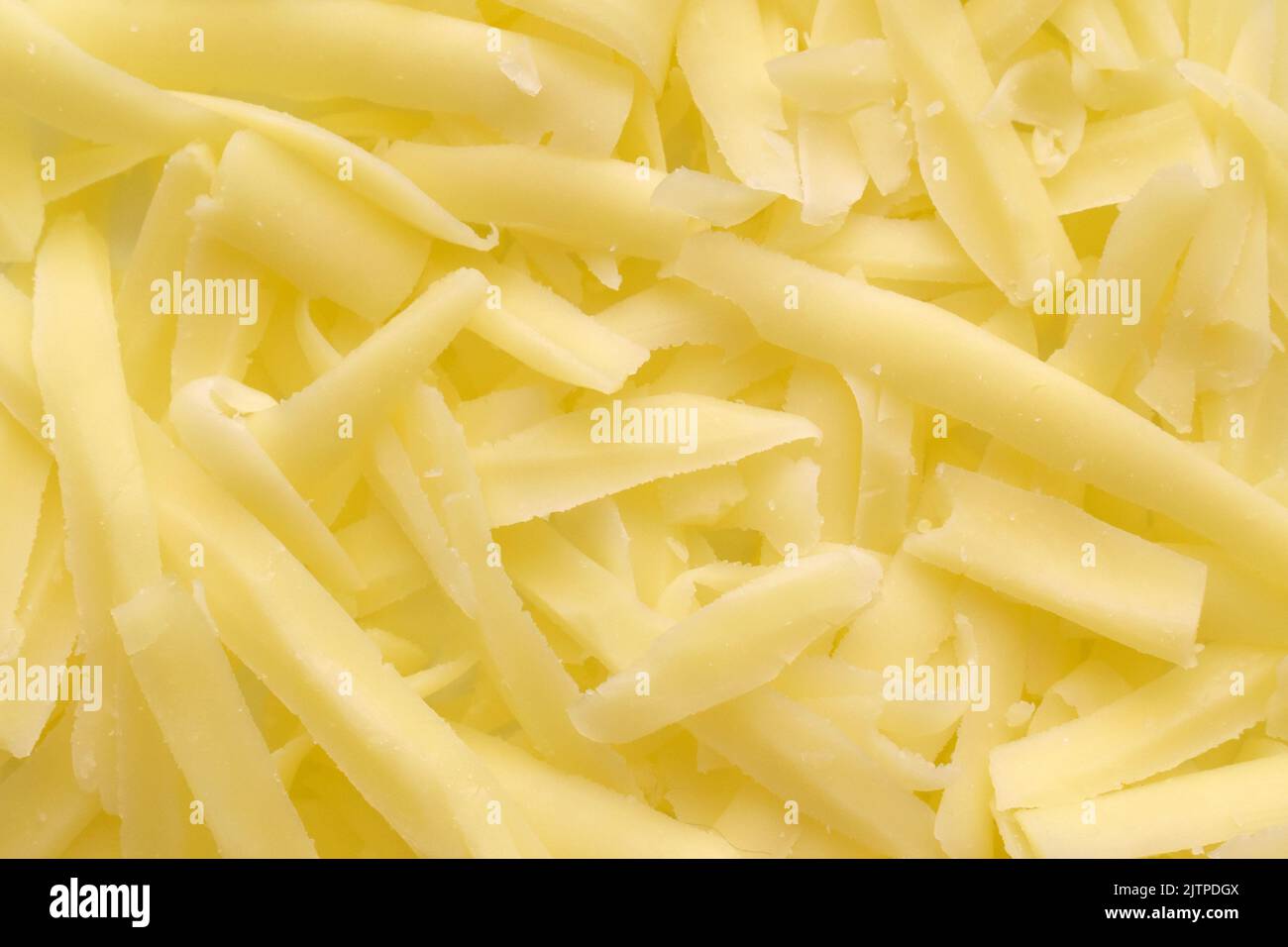 Geriebener Käse Textur Hintergrund. Stockfoto
