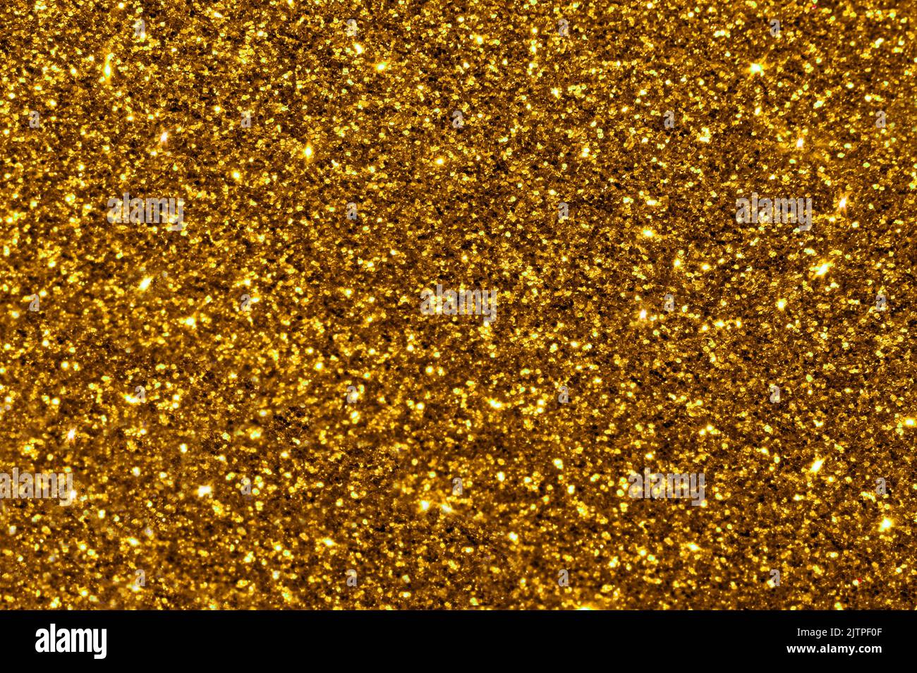 Goldgelber Glitter Bokeh Hintergrund. Das Foto kann für Neujahr, Weihnachten und alle Festlichkeiten verwendet werden. Stockfoto