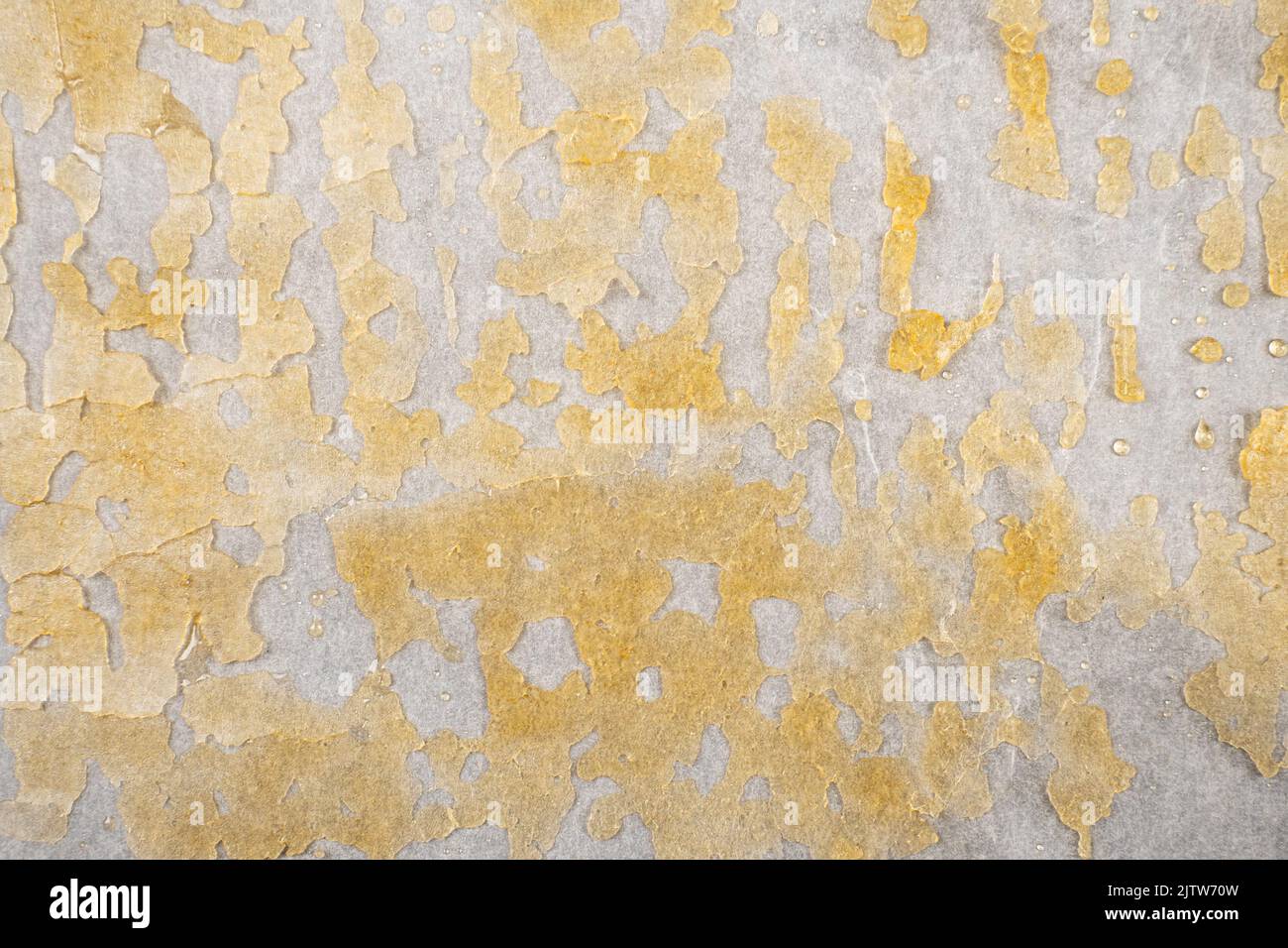 goldener Hintergrund von Marihuanawachs, Cannabis-Tupfer-Textur. Stockfoto