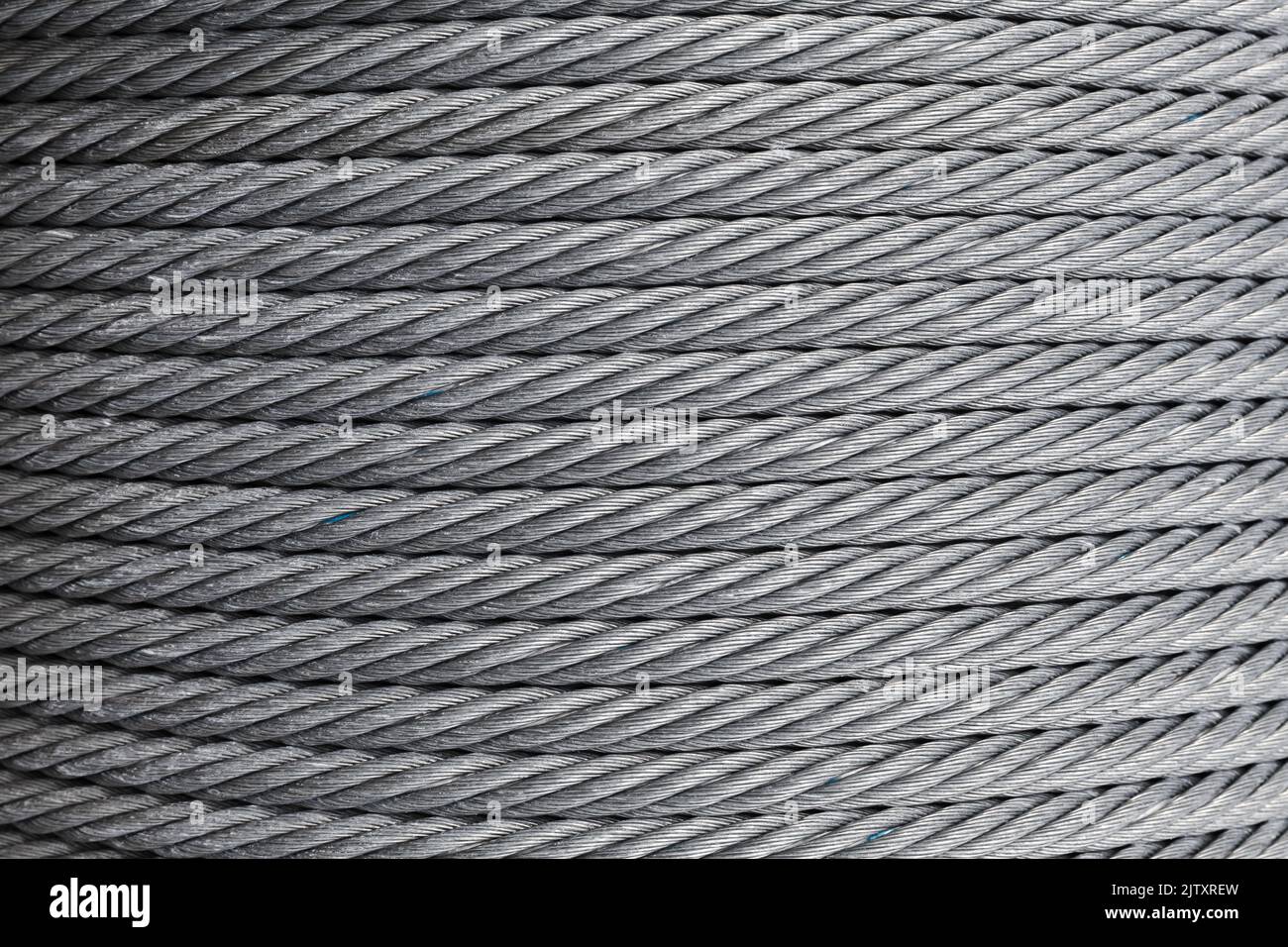 Stahlseil ist auf einer Winde, abstrakt industriellen Hintergrund Textur Stockfoto