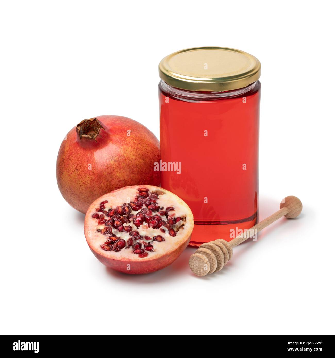 Glas mit Granatapfelhonig und frischer Granatapfelfrucht isoliert auf weißem Hintergrund Stockfoto