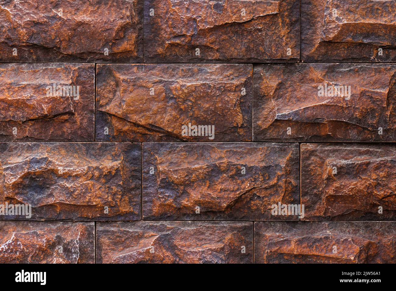 Gefälschte Ziegelwand, Kunststoffplatte imitiert natürliche Steinblöcke Mauerwerk Stockfoto