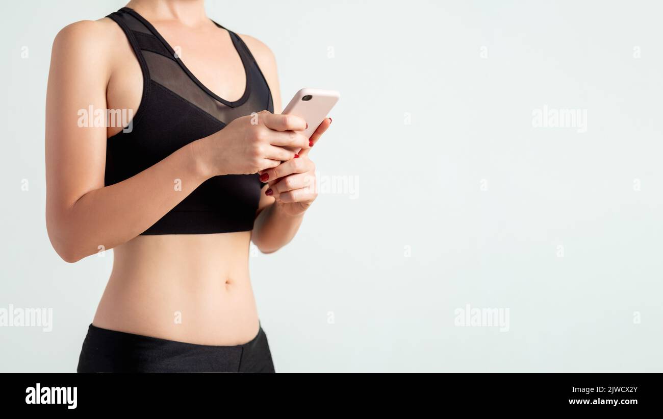 Online Gym mobile Sport App Frau Smartphone Stockfoto