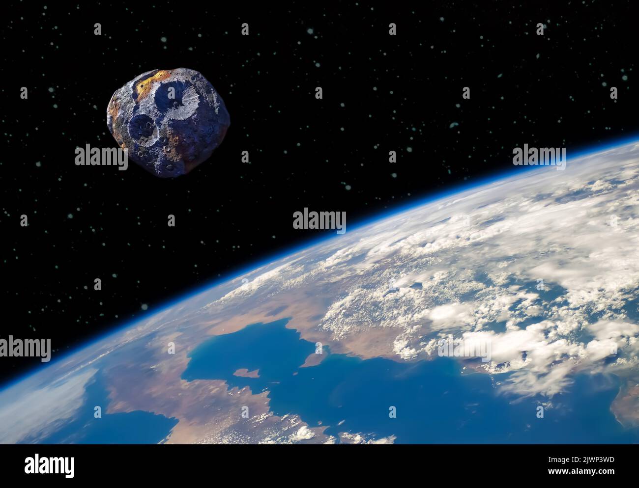 Ein Astroid und Planet Erde im All. Elemente des Bildes, die von der NASA eingerichtet wurden. Stockfoto