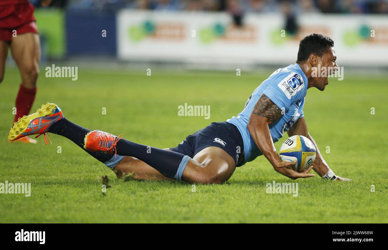 Waratahs Israel Folau reagiert nach einem Versuch während des Round 3 Super Rugby Spiels zwischen den NSW Waratahs und den Queensland Reds am Samstag, 1. März 2014 im ANZ Stadium in Sydney. (AAP-Bild/Daniel Munoz) Stockfoto