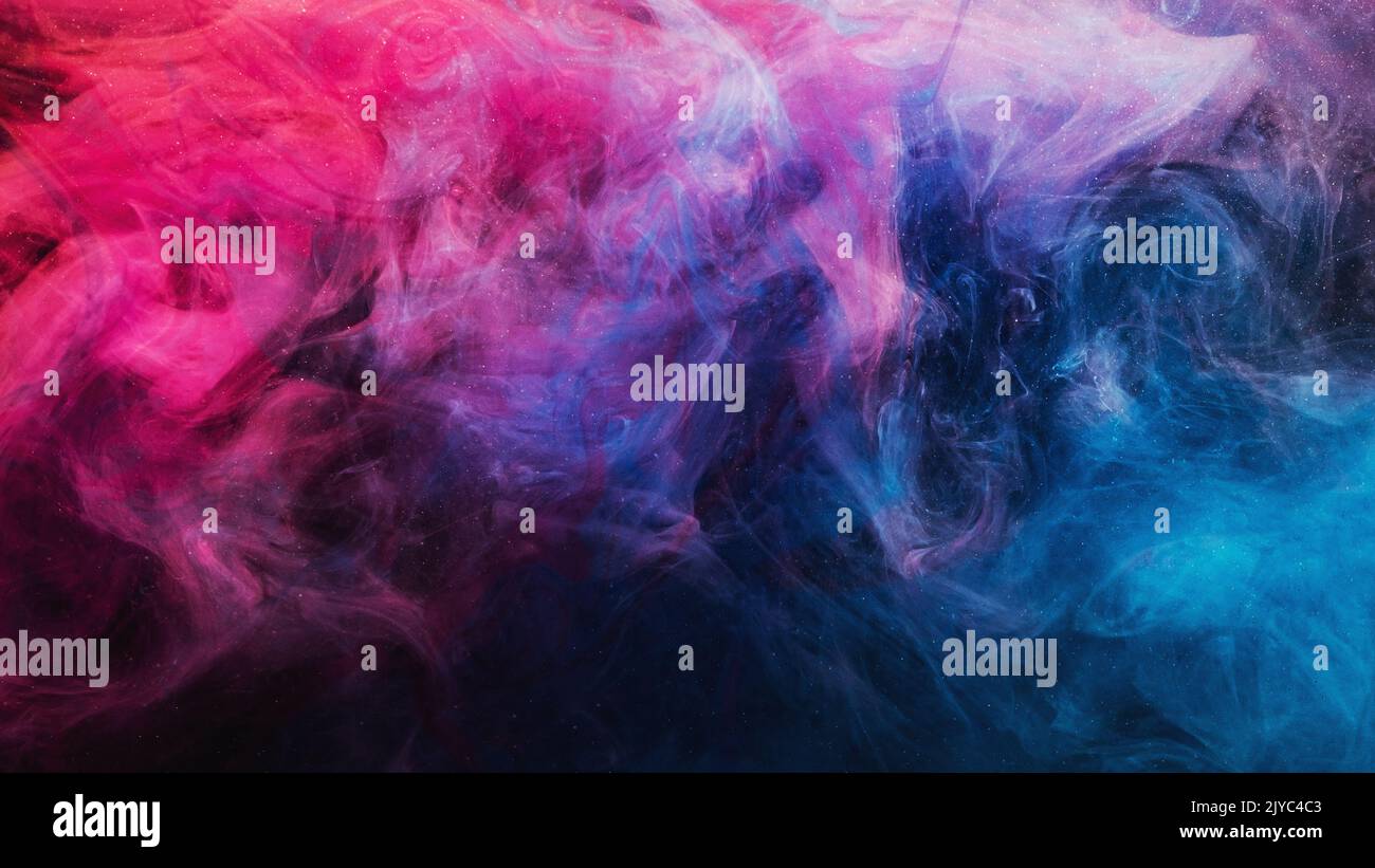 Tinte im Wasser bunten Hintergrund blau lila rosa Stockfoto