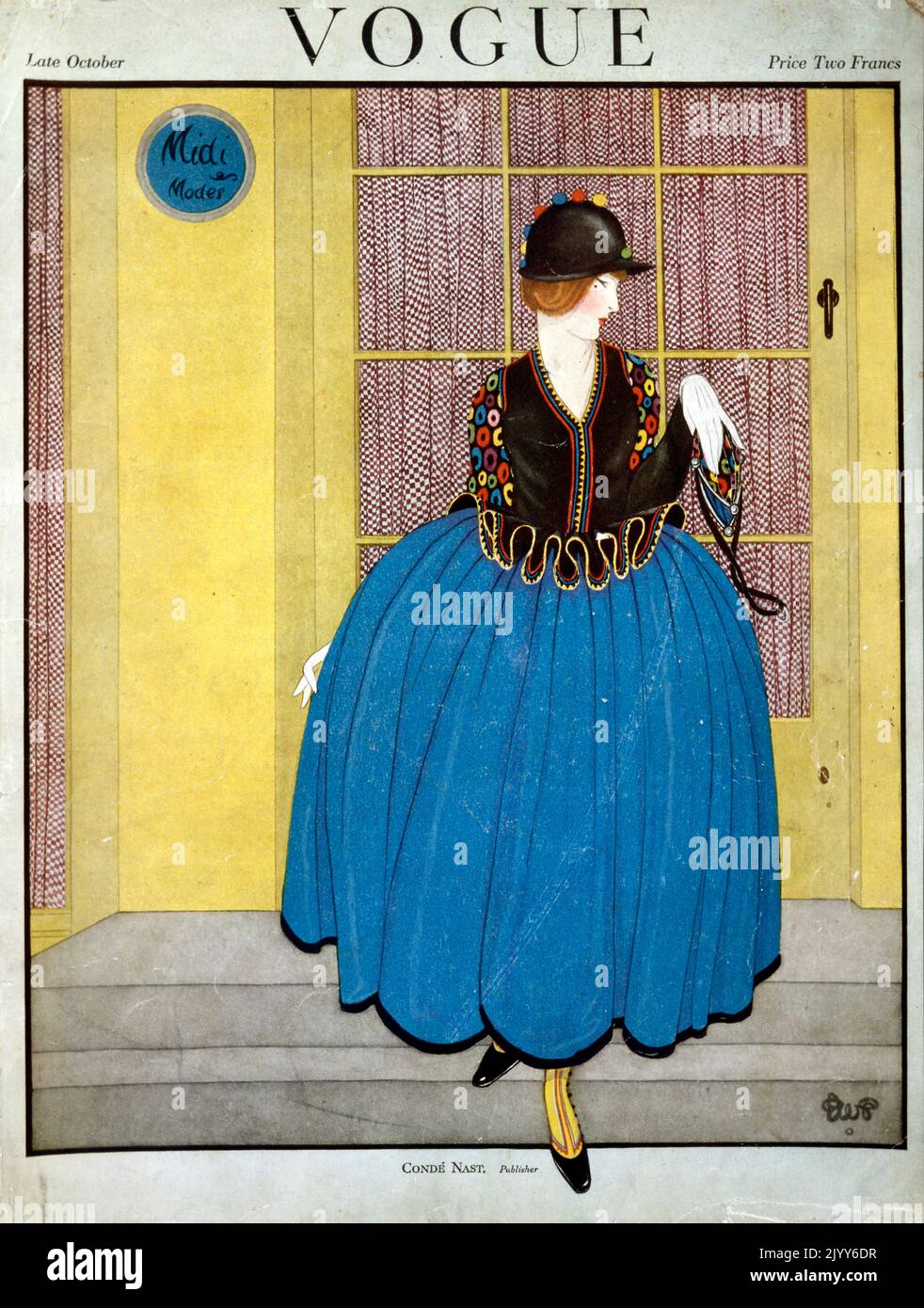 Frontcover des Magazins Vogue; Ende Oktober; herausgegeben von Cond Nast and Co., London; eine Dame trägt einen blauen Rock mit Pufffarbe an einer gelben Tür. Stockfoto
