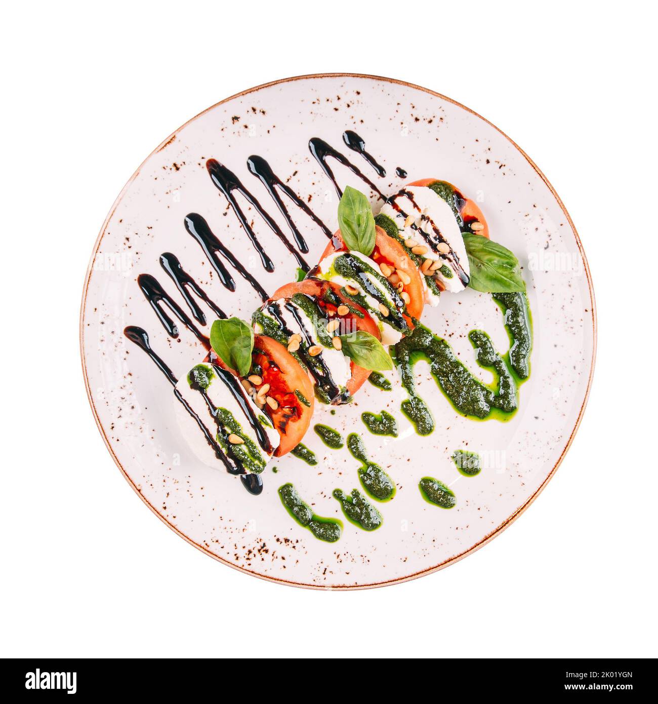 Portion Caprese-Salat mit Pesto-Sauce Stockfoto