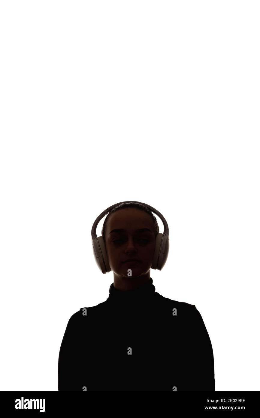 Weibliche Silhouette Audio Sound kabellose Kopfhörer Stockfoto