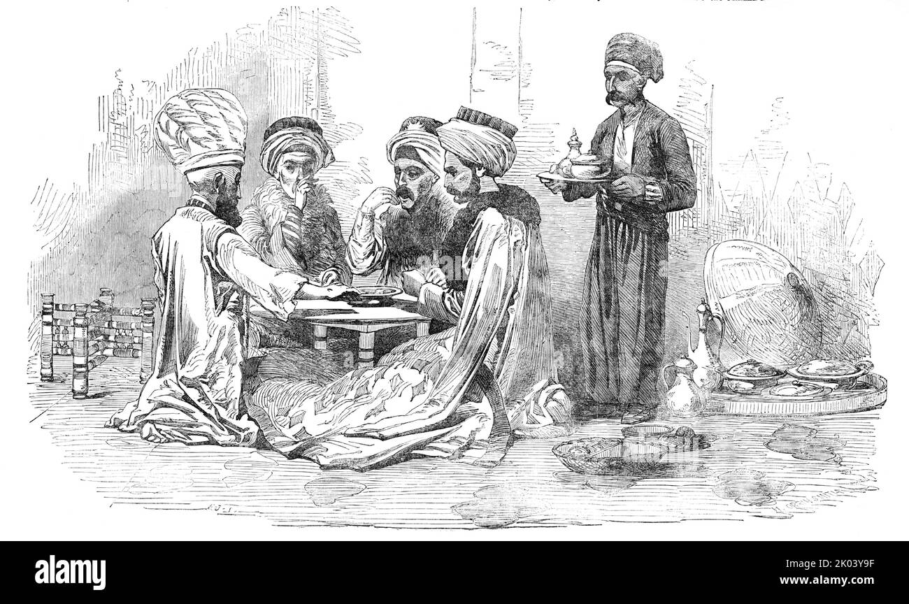 The Turkish Exhibition and Museum, Hyde-Park-Corner - A Turkish Dinner Party, 1854. Tableau von Wachsfiguren, die "eine Wahlparty von "normalen Türken" darstellen, die am Esstisch hocken [angezeigt von]"...Herren. Oscanyan und Aznavour, die unternehmungslustigen Manager... eines Orientalischen Museums - eine Sammlung türkischer Kostüme, Rüstungen, Figuren u. a., die sowohl die politischen Institutionen als auch die sozialen Gewohnheiten der Osmanli-Nation illustrieren...die Wohnung, in der sie untergebracht ist, ist die St. George's Gallery [in London]...der Zuschauer, Allerdings wird noch mehr mit dem bewunderungswerten geschlagen werden Stockfoto