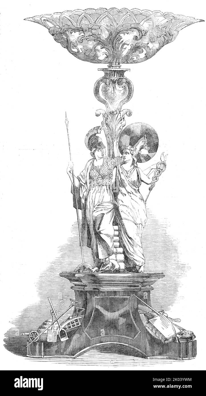 Erfahrungsbericht, der William Morris, Esq, von den Einwohnern von Carmarthen, 1854 überreicht wurde. 'Epergne...von Herrn Alfred Brown modelliert, für die Manufaktur der Herren Hunt und Roskell...die dreieckige Basis trägt Morris Wappen und Wappen; und die folgende Inschrift: "Von seinen Mitbürgern Herrn William Morris als Zeichen ihres Gefühls für die Effizienz und Freigiebigkeit, mit der er die Pflichten des Hauptrichters erfüllt hat..." Unter den Winkeln are...devices der Justiz, des Handels und der Landwirtschaft. Auf der Basis steht eine klassisch gestaltete Figur von Minerva mit aufgeschrägten sp Stockfoto