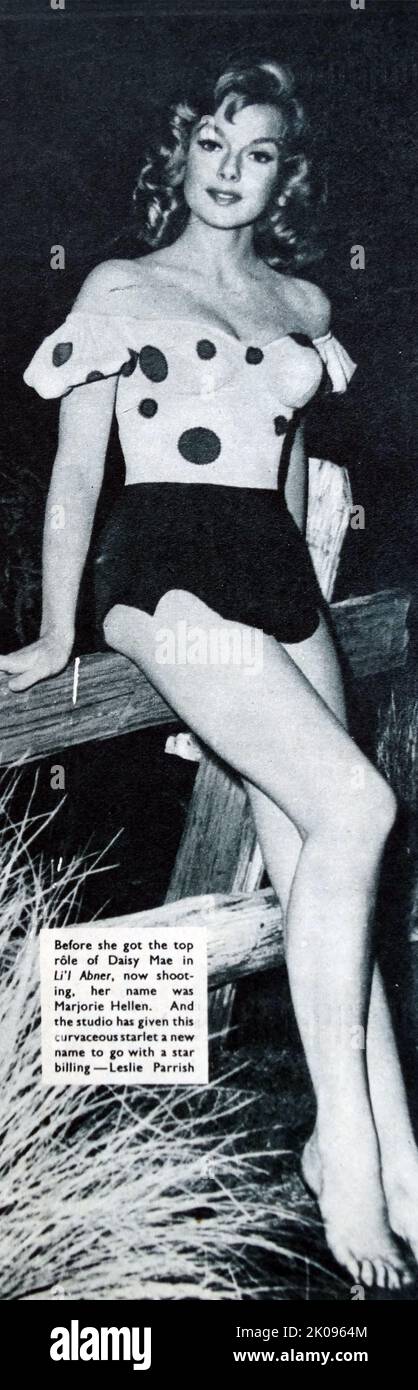 Leslie Parrish in Li'l Abner, einem Musikfilm aus dem Jahr 1959. Leslie Parrish (*Marjorie Hellen; 18. März 1935) ist eine amerikanische Schauspielerin, Aktivistin, Umweltschützerin, Schriftstellerin und Produzentin. Sie arbeitete sechs Jahre lang unter ihrem Geburtsnamen, was sie 1959 änderte. Stockfoto