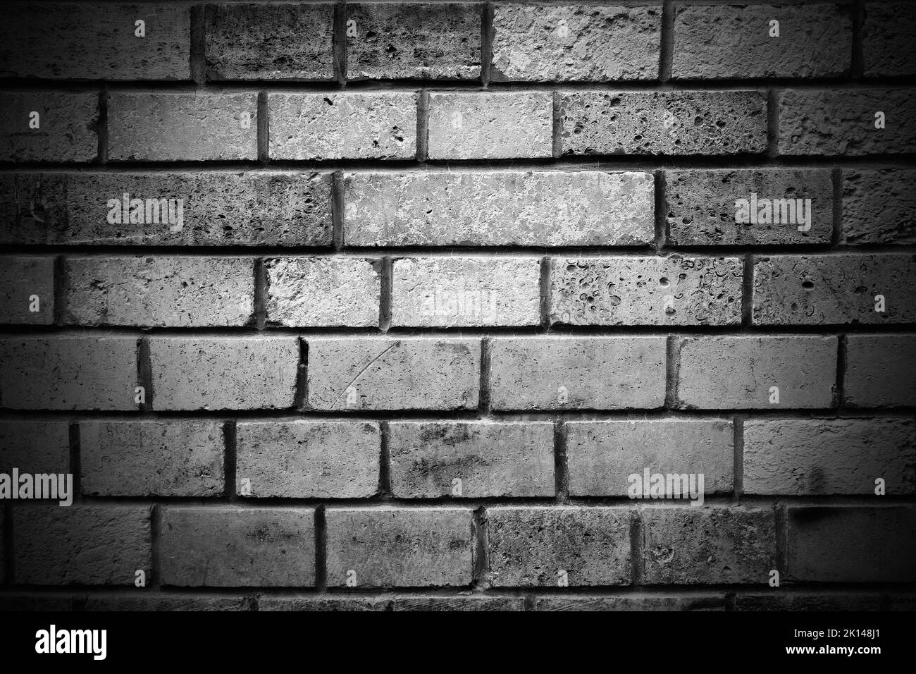 Steinmauer veraltete Vignette Hintergrund als schwarz und weiß Stockfoto