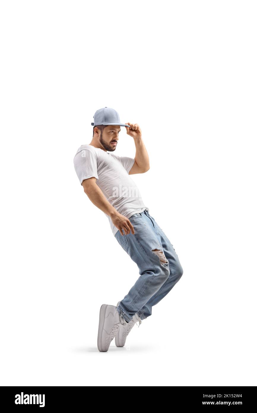 Kerl tanzt und hält seine Mütze isoliert auf weißem Hintergrund Stockfoto