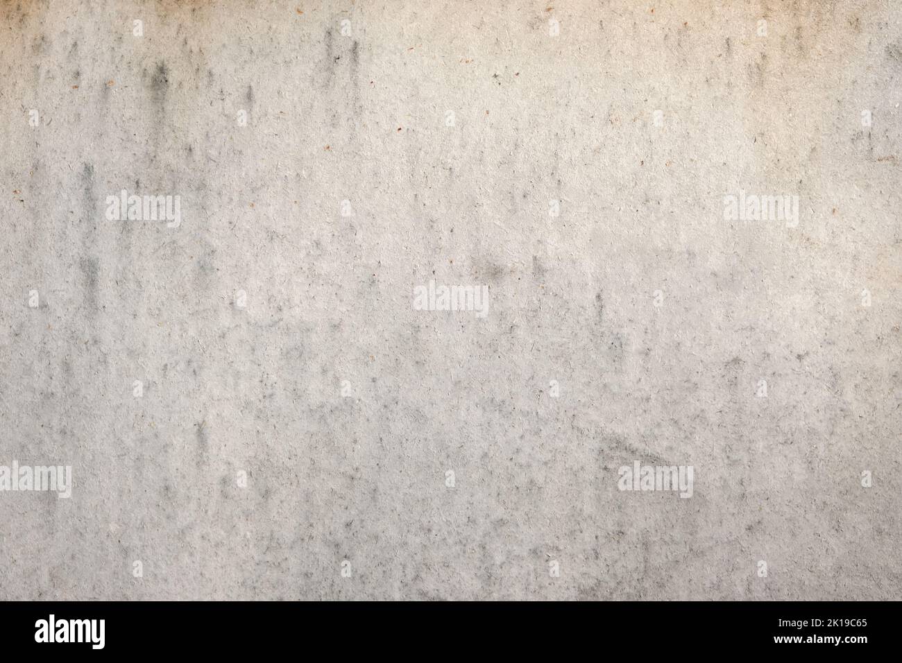 Graue Filzstruktur. Die Textur von weißem Filz. Silberfarbener Hintergrund. Stockfoto