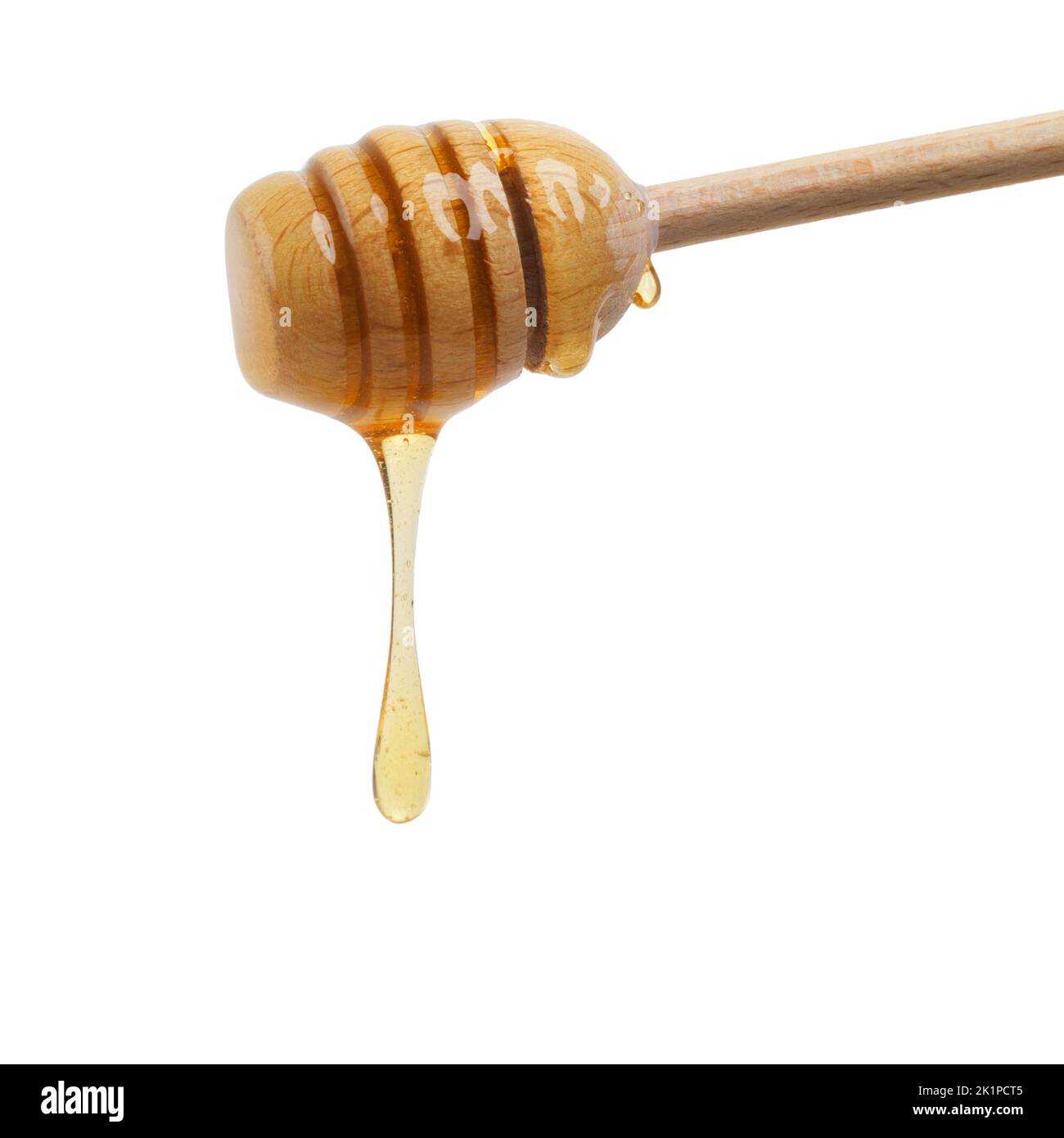 Nahrung der Götter. Nahaufnahme eines Honiglöffels, der köstlichen Honig tropft. Stockfoto