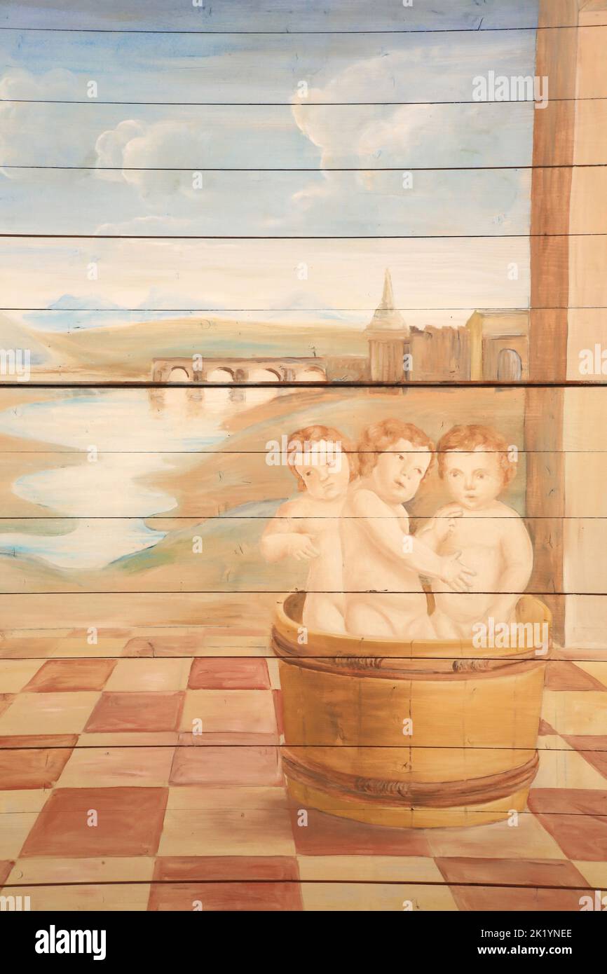Trois enfants dans une bassine en bois. Détails. Saint-Nicolas de Myre. Peinture murale Restaurant par Edouard Borga. Eglise Saint-Nicolas de Combloux. Stockfoto
