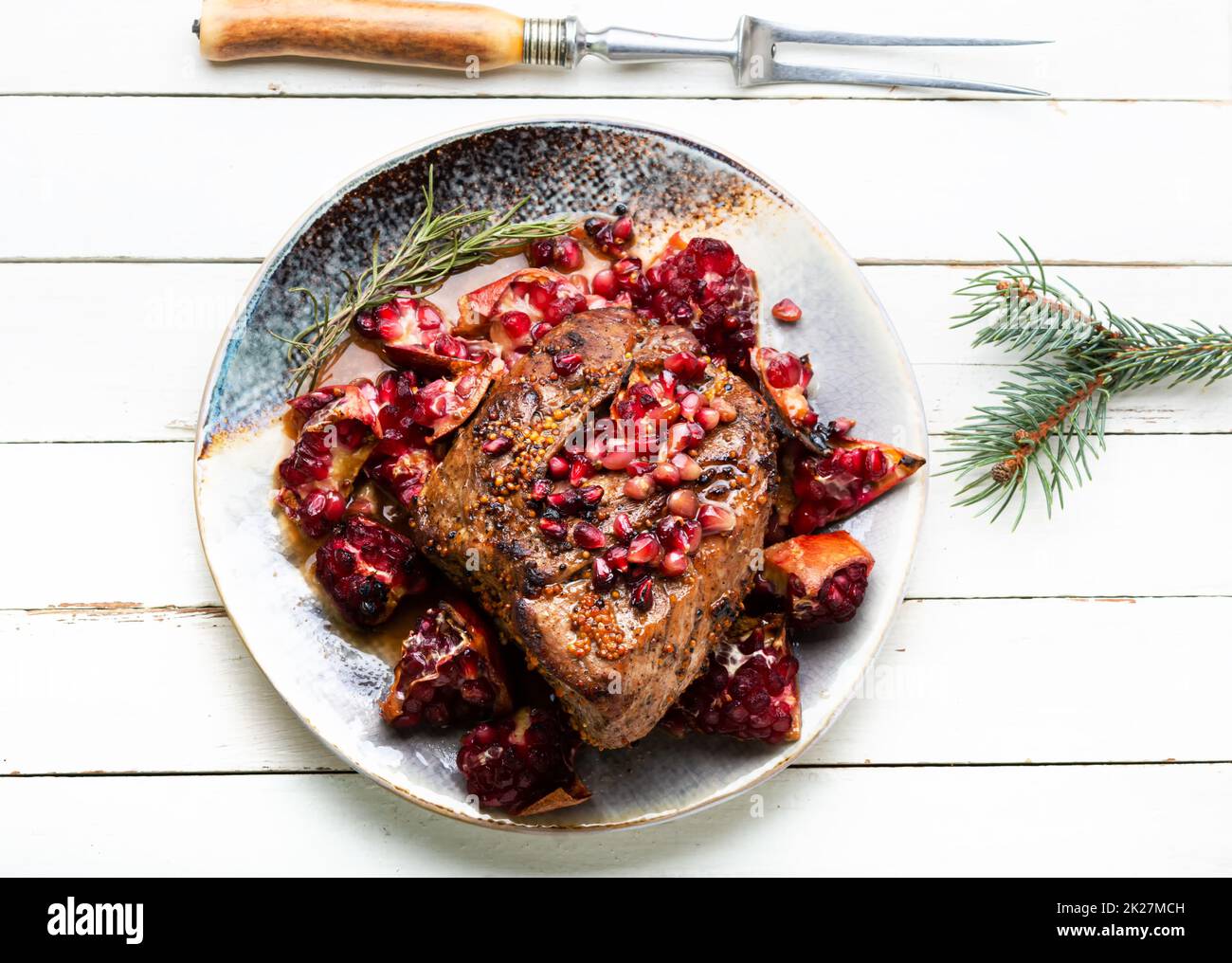 Schweinefleisch mit Granatäpfel Stockfoto