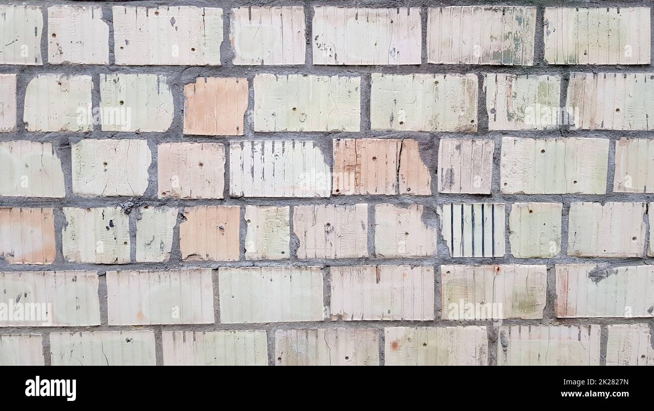 Grauer Steinwandhintergrund. Die Textur des Steins. Alte Burgmauer im Hintergrund. Steinwand als Hintergrund oder Textur. Teil der Wand, für Hintergrund oder Textur. Stockfoto