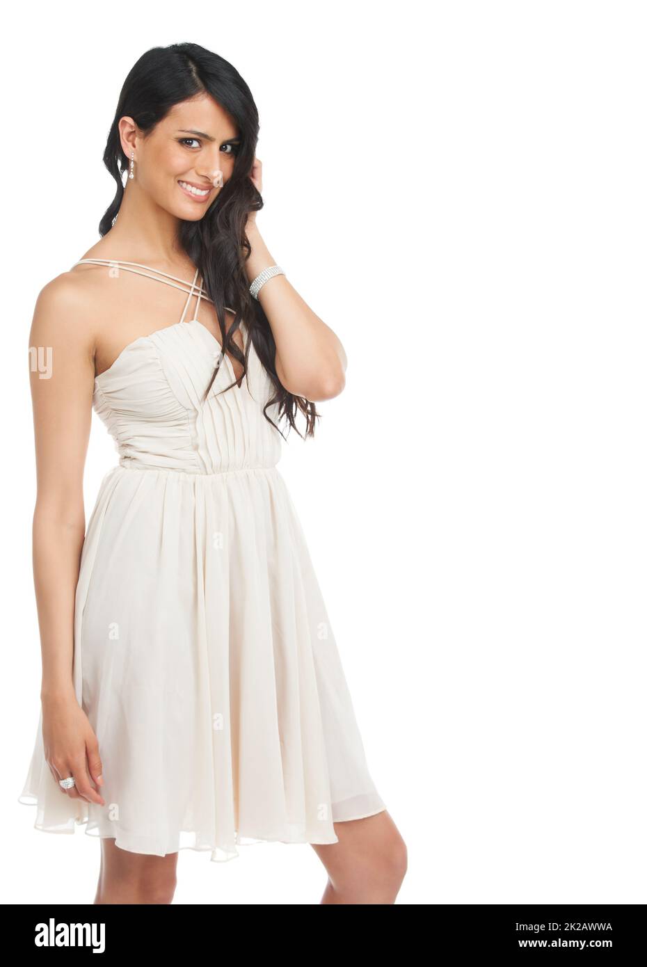 Alle Jungs träumen Mädchen. Studioaufnahme einer attraktiven jungen Frau in einem Cocktailkleid, das vor weißem Hintergrund posiert. Stockfoto