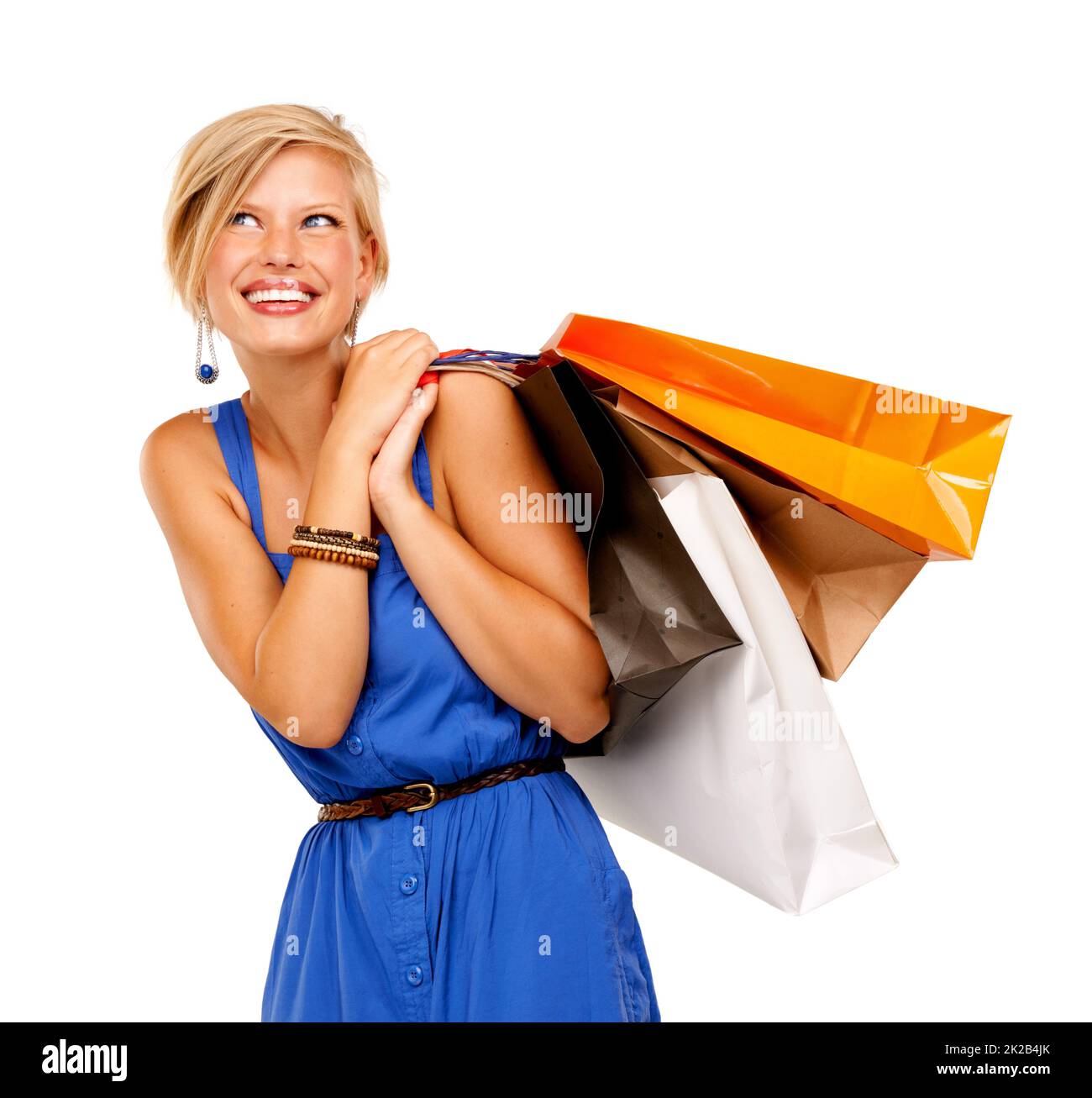 Weiter zum nächsten Verkauf. Eine attraktive junge Frau mit einem Haufen Einkaufstaschen. Stockfoto