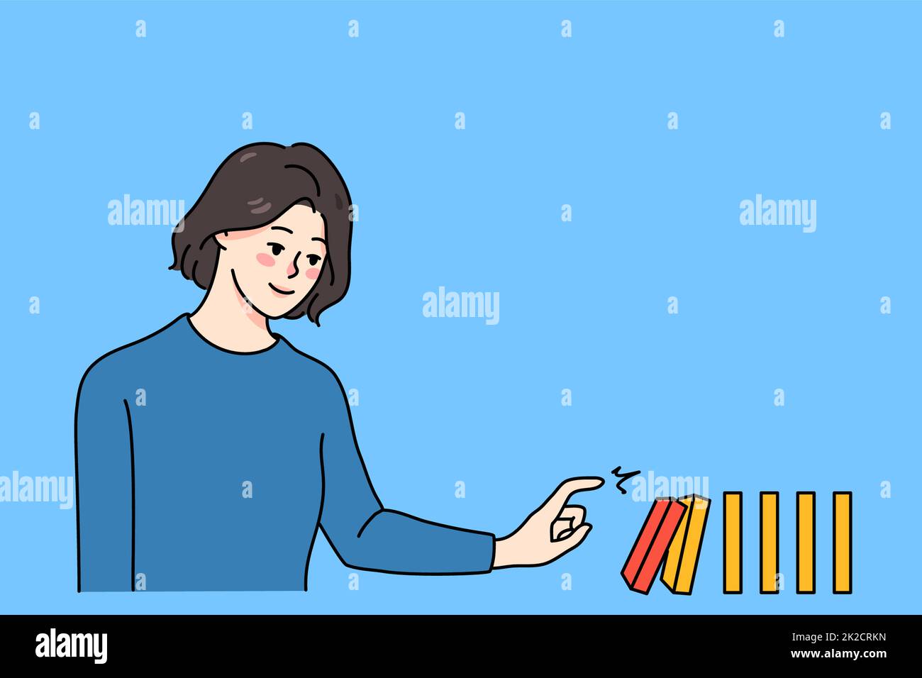 Eine Frau, die den Domino umstürzt, fällt Stockfoto