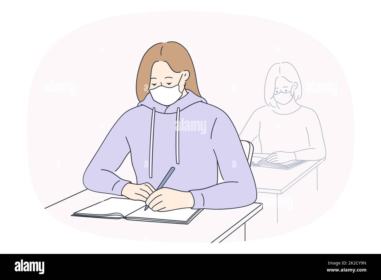 Schüler im Gesichtsmaskenstudium während Covid in der Schule Stockfoto