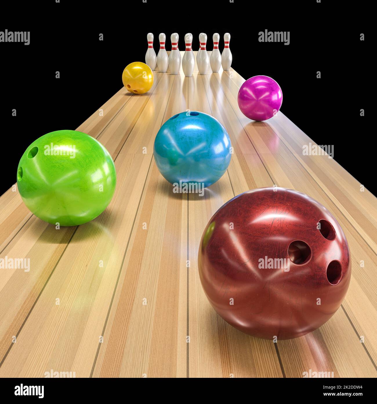 Farbige Bowlingkugeln und Kegel. Stockfoto
