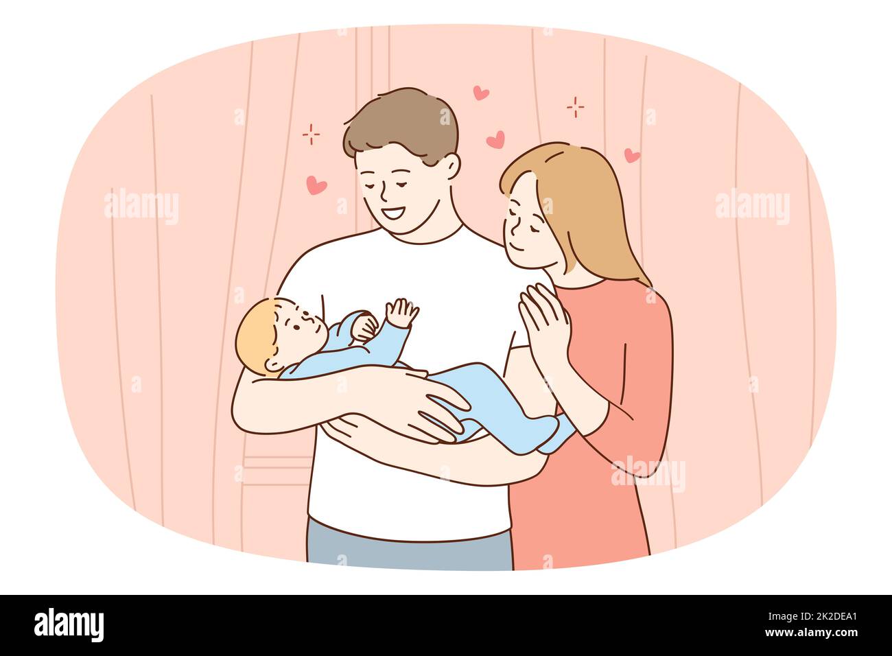 Glückliche, liebende junge Familie, die ein Neugeborenes hält Stockfoto