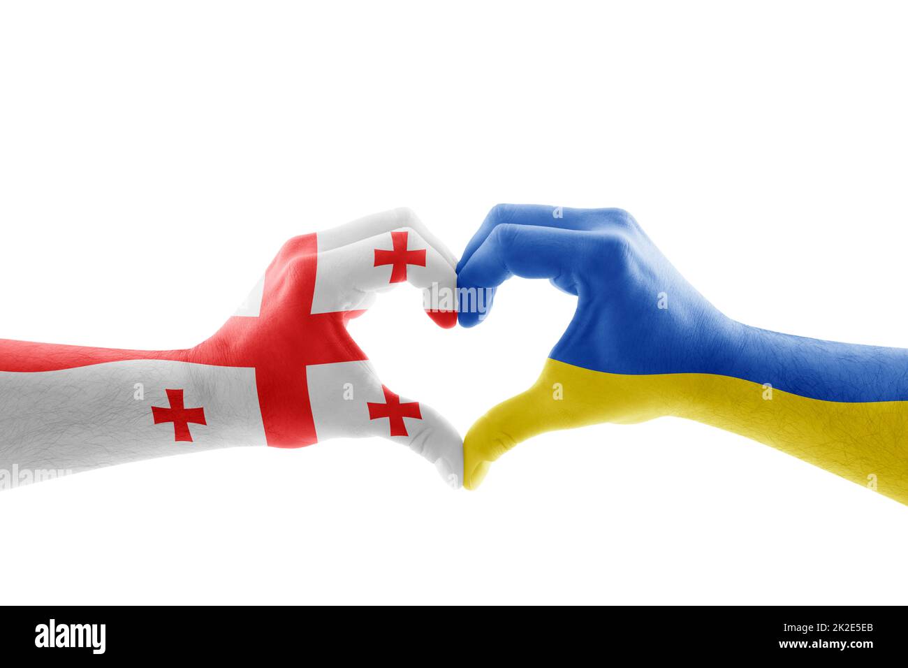 Zwei Hände in Herzform mit georgischer und ukrainischer Flagge isoliert auf weißem Hintergrund Stockfoto
