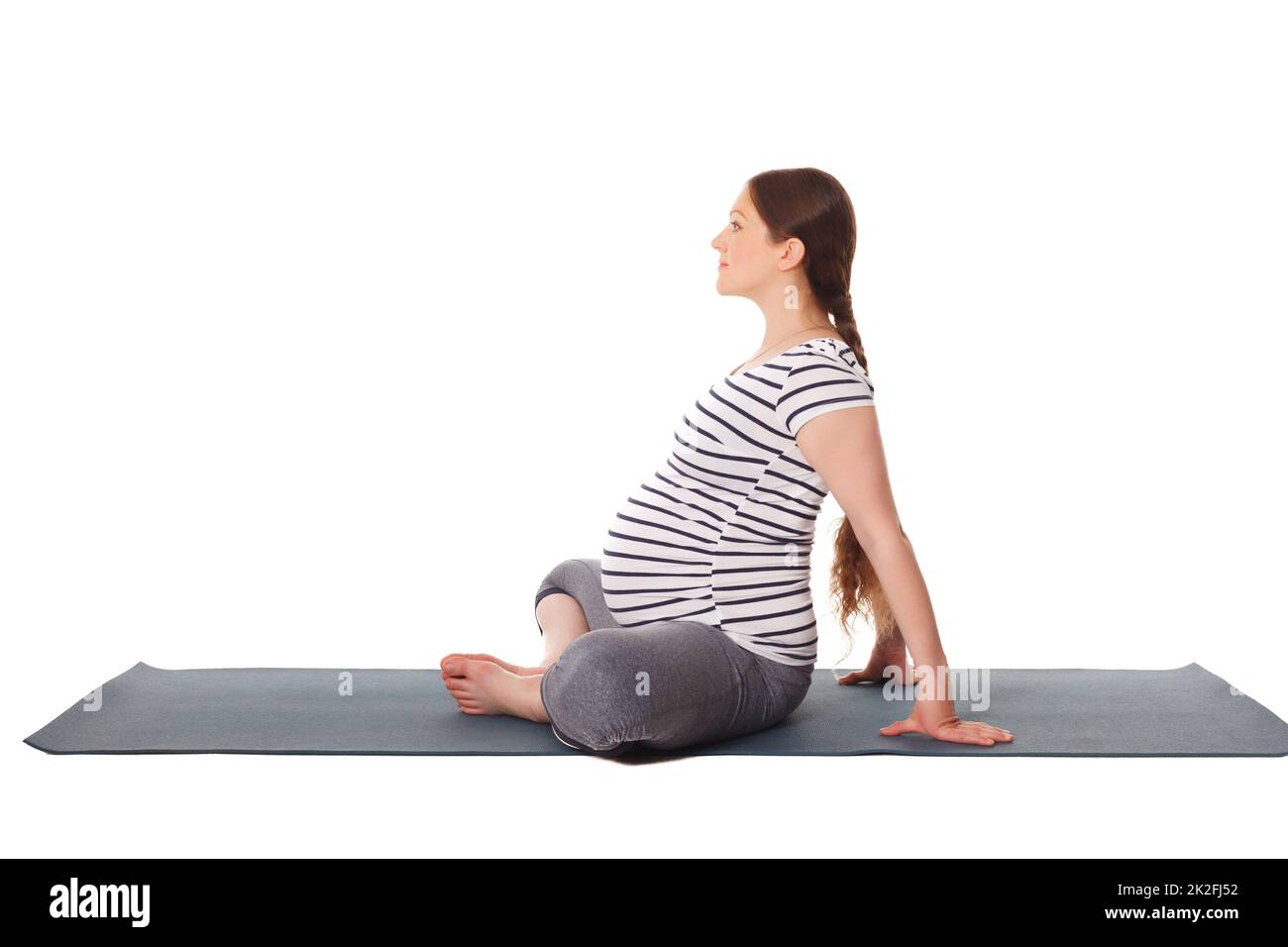 Schwanger Frau macht Yoga Asana Baddha Konasana Stockfoto