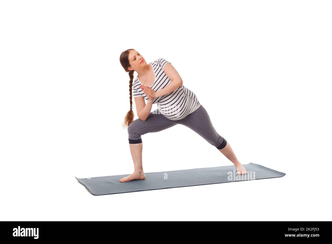 Schwanger Frau macht Yoga Asana Utthita Parsvakonasana Stockfoto