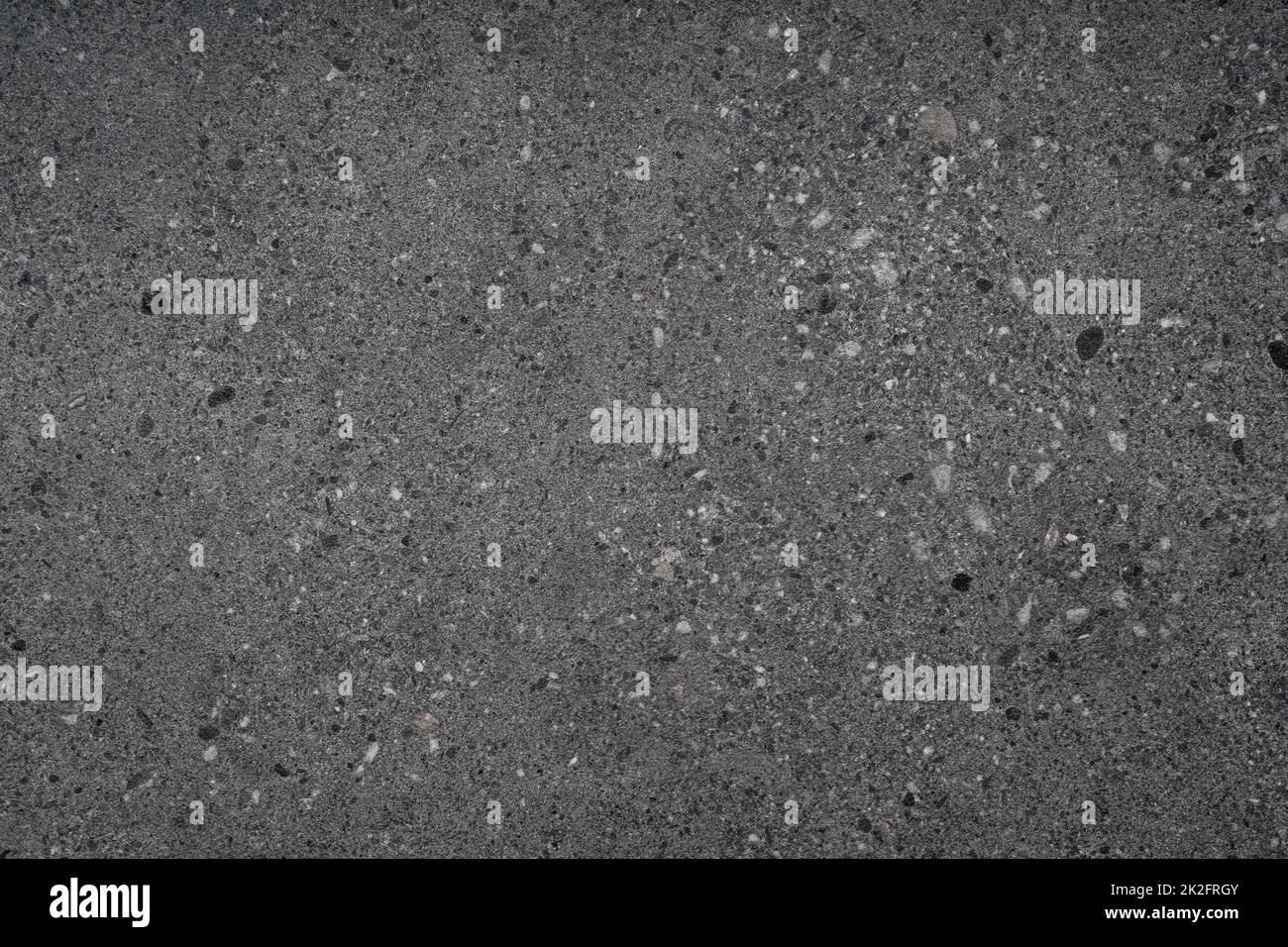 Schwarz grau Kies Stein Terrazzo Wand Hintergrund Stockfoto