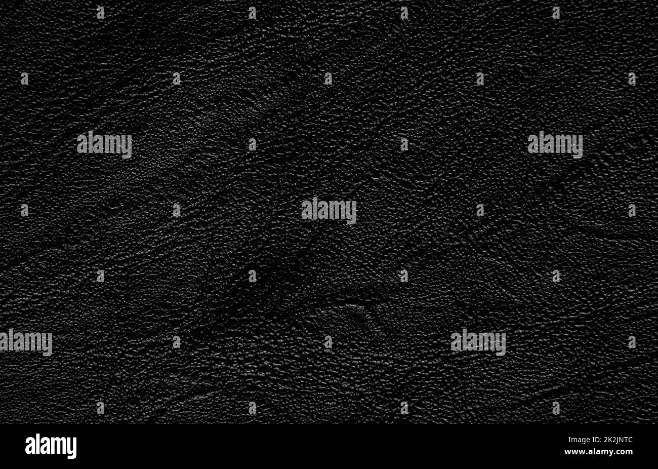 Schwarzer, strukturierter Hintergrund aus echtem Leder. Stockfoto