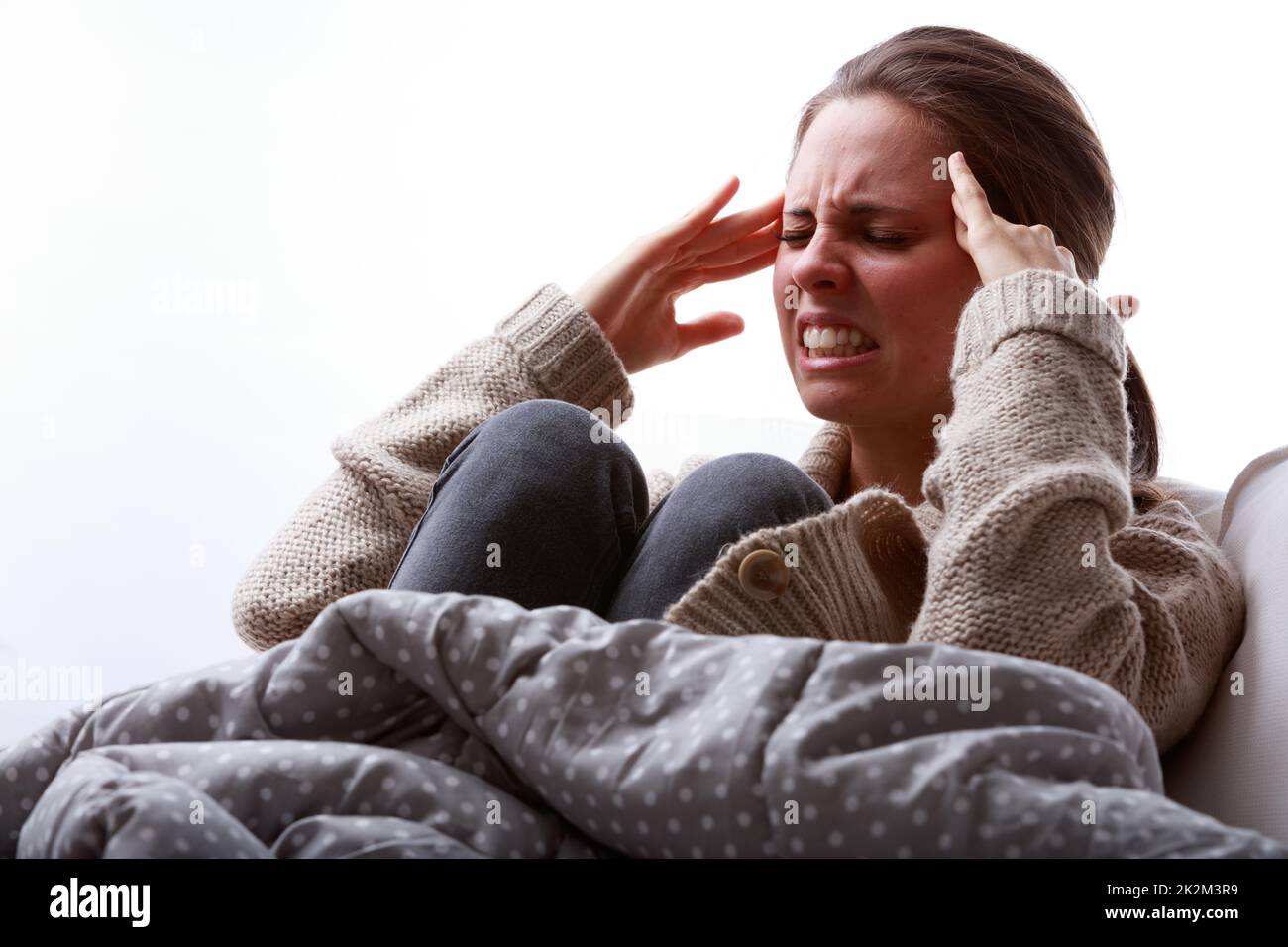 Junge Frau mit Kopfschmerzen oder Migräne Stockfoto