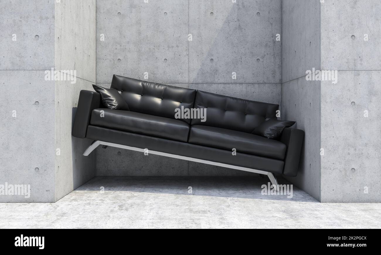 Schwarzes Sofa zwischen zwei Betonwänden. Stockfoto