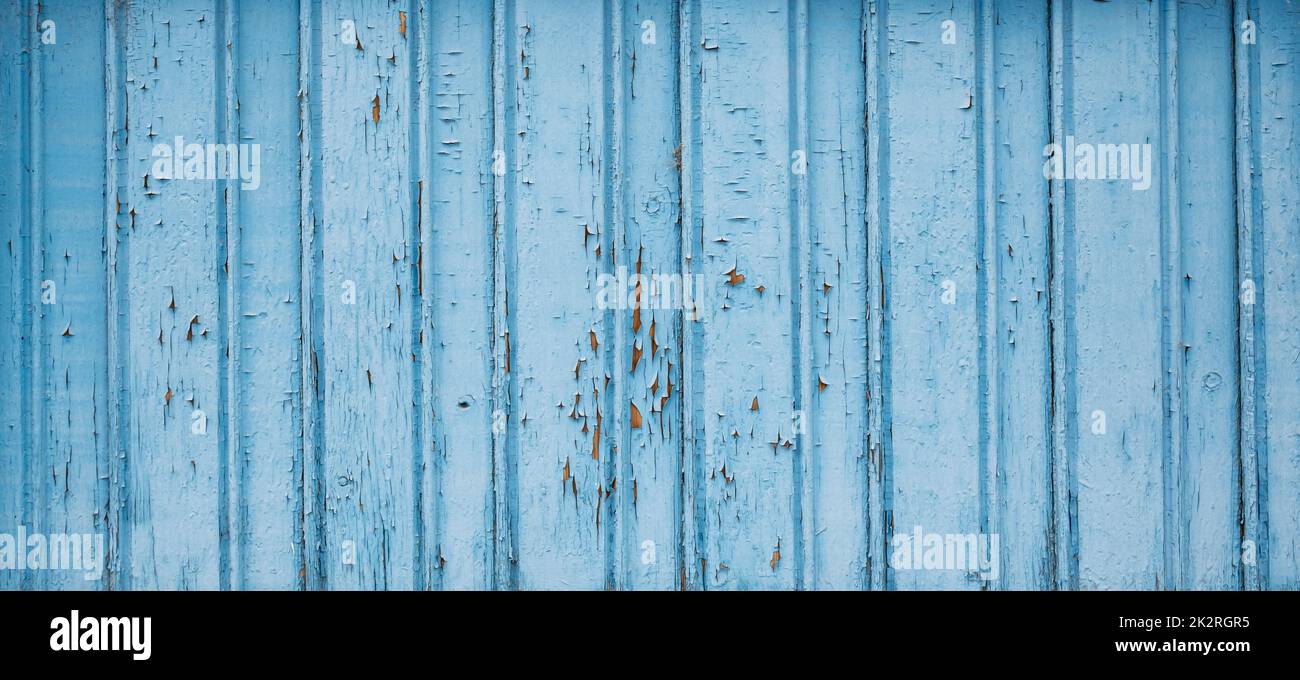 Die strukturierte Holzkulisse altert in rauhblau Stockfoto