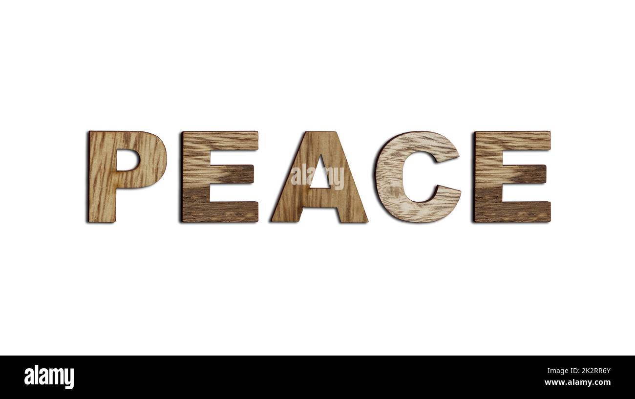 Frieden, Wort in hölzernen Buchstaben isoliert. Das Konzept eines schrecklichen Krieges, der ein Land zerstört Stockfoto