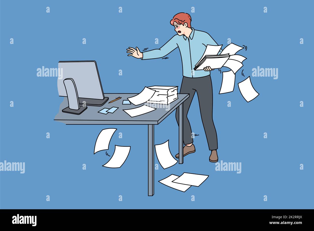 Ungeschickter Angestellter sammelt Papierkram im Büro ein Stockfoto