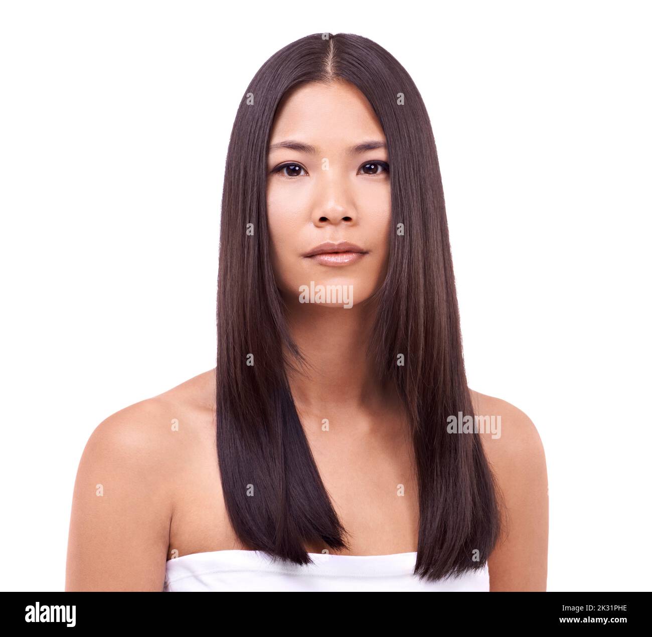 Orientalische Schönheit. Eine schöne junge orientalische Frau vor weißem Hintergrund. Stockfoto