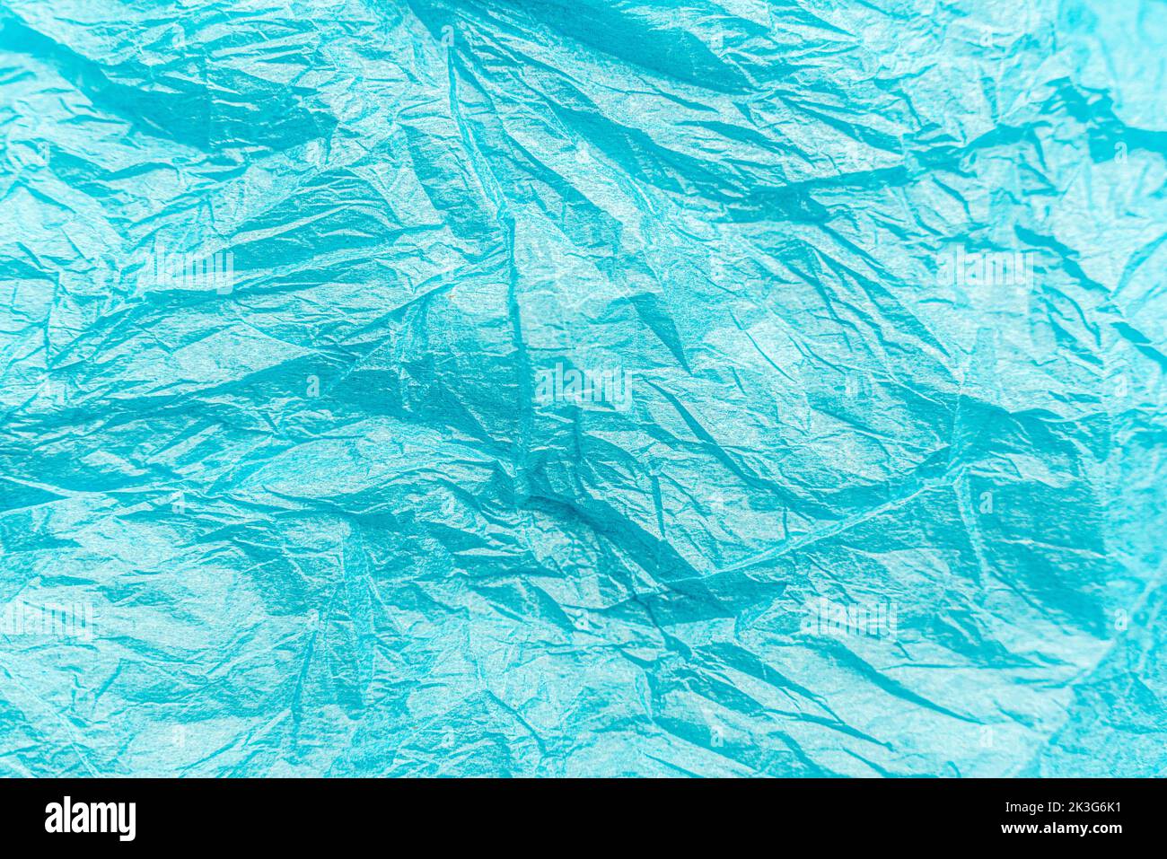 Zerknittert Papier Kunst texturierten Hintergrund blau farbig gefaltet abstrakten Boden Stockfoto