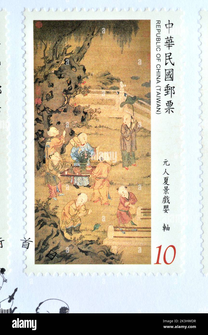 REPUBLIK CHINA (TAIWAN) - UM 2014:Eine in Taiwan gedruckte Marke zeigt alte chinesische Malerei aus dem National Palace Museum - Children at Play postag Stockfoto