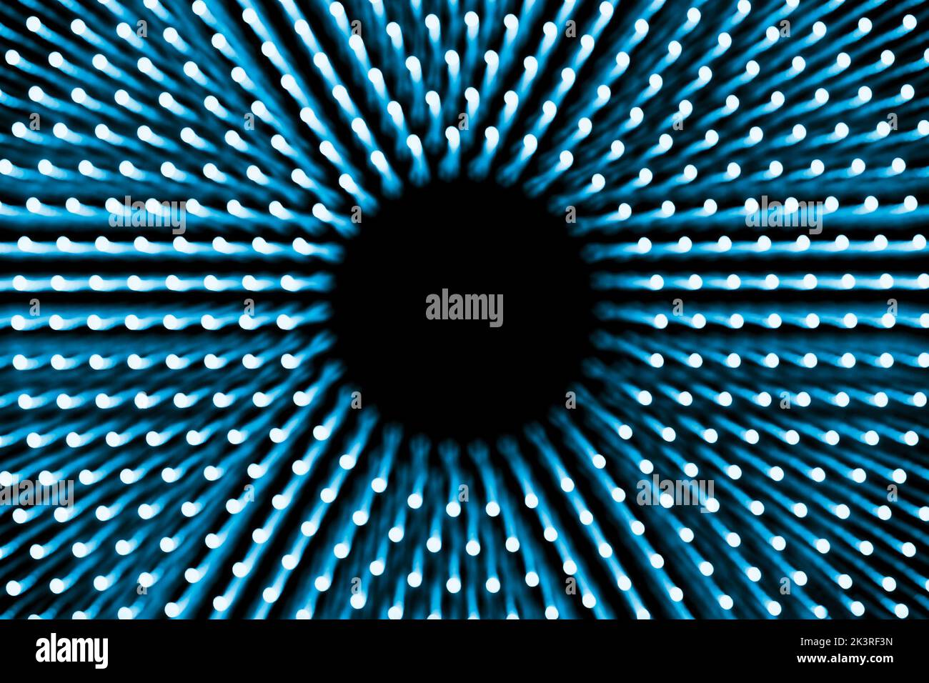 Abstrakter blauer Hintergrund konzentrisch leuchtender Punkte mit Unschärfe Stockfoto
