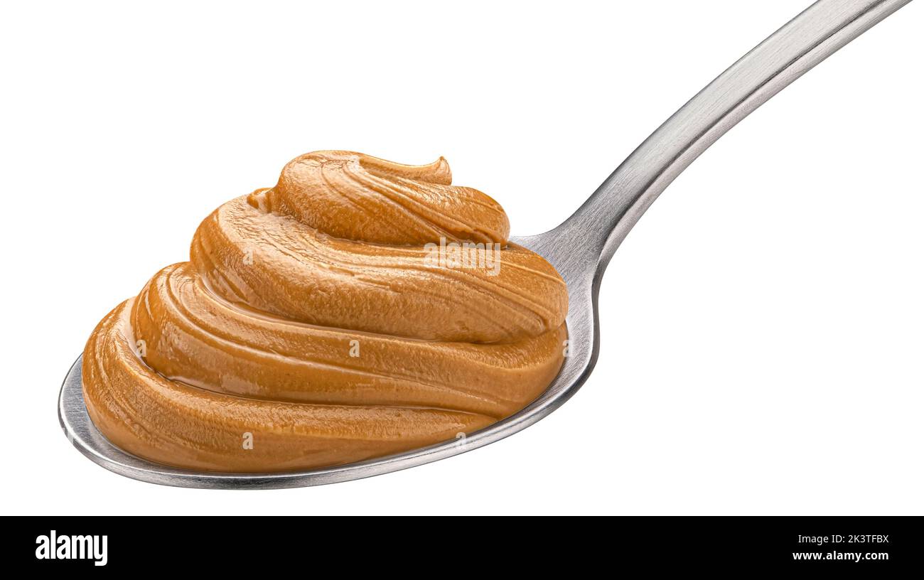 Erdnussbutter in Löffel isoliert auf weißem Hintergrund Stockfoto